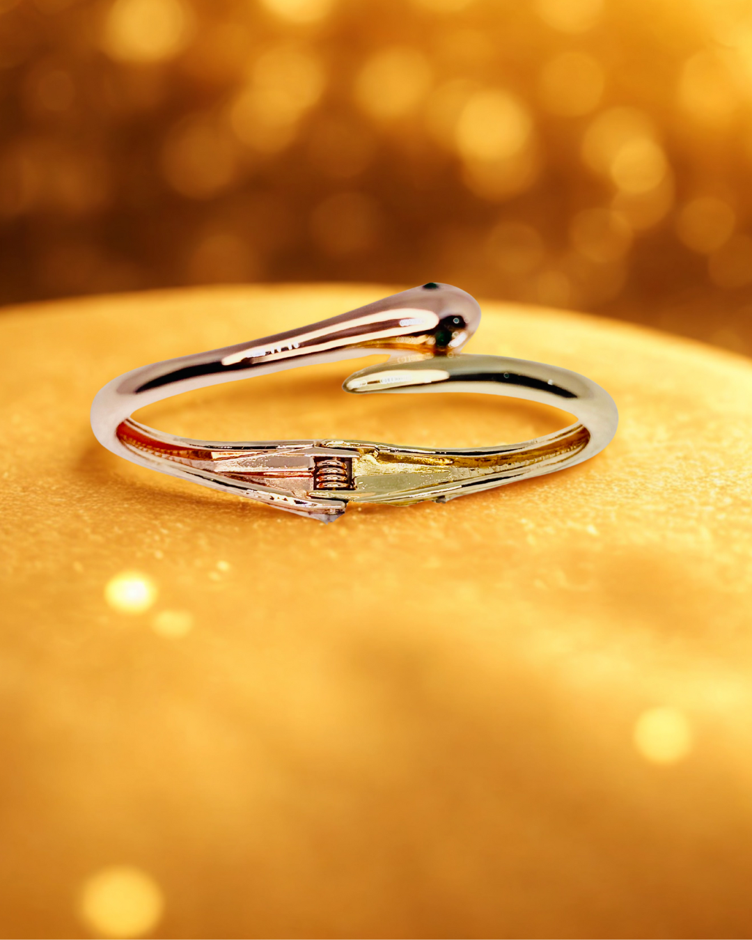 Serpent Glow Cuff(elegant bracelet with a snake-inspired)