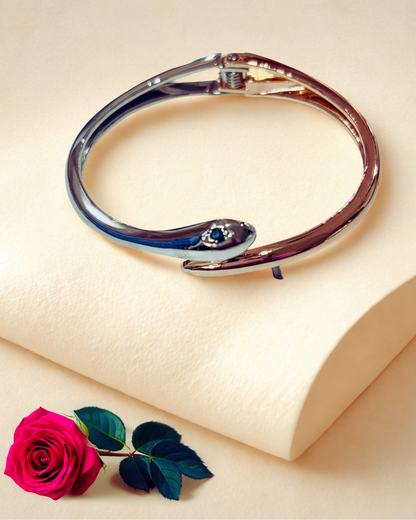 Serpent Glow Cuff(elegant bracelet with a snake-inspired)