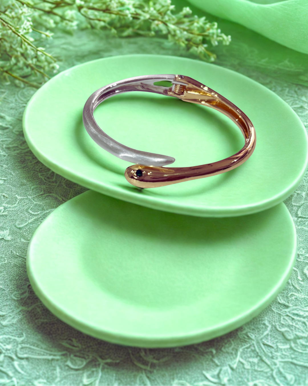 Serpent Glow Cuff(elegant bracelet with a snake-inspired)