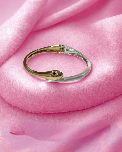 Serpent Glow Cuff(elegant bracelet with a snake-inspired)