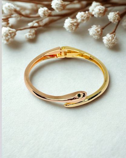 Serpent Glow Cuff(elegant bracelet with a snake-inspired)